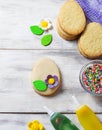 Cookies with decorations tools Ã¢â¬â icing, marzipan flower, nonpareil Royalty Free Stock Photo